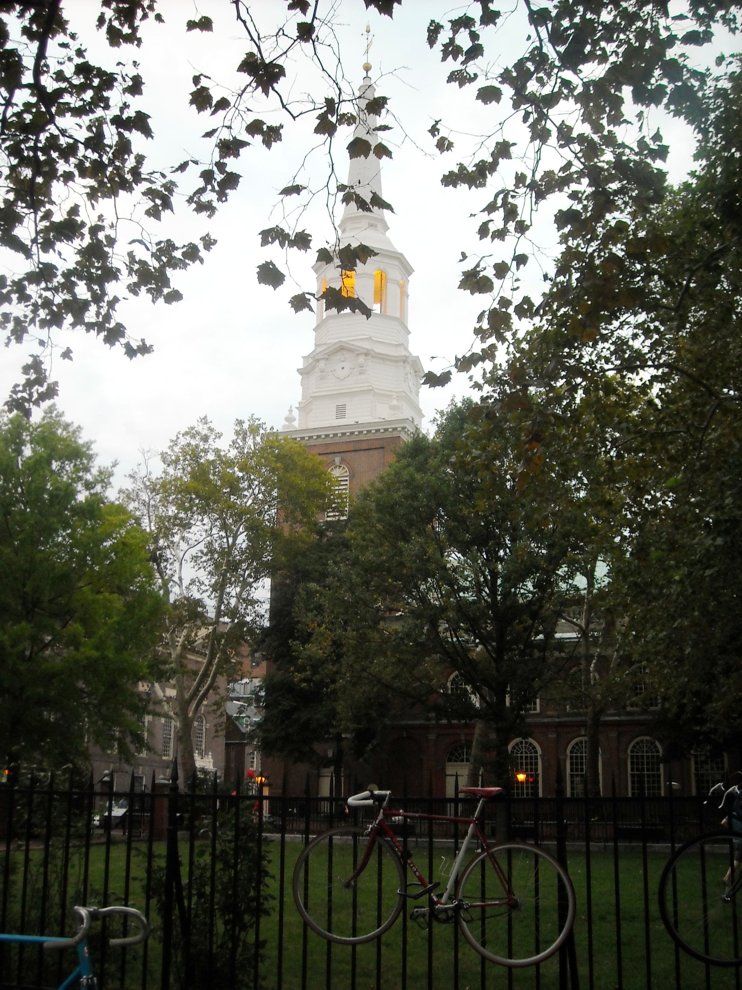 The exterior of Christ Church, Philadelphia, showing the brick Georgian facade and the tall steeple.