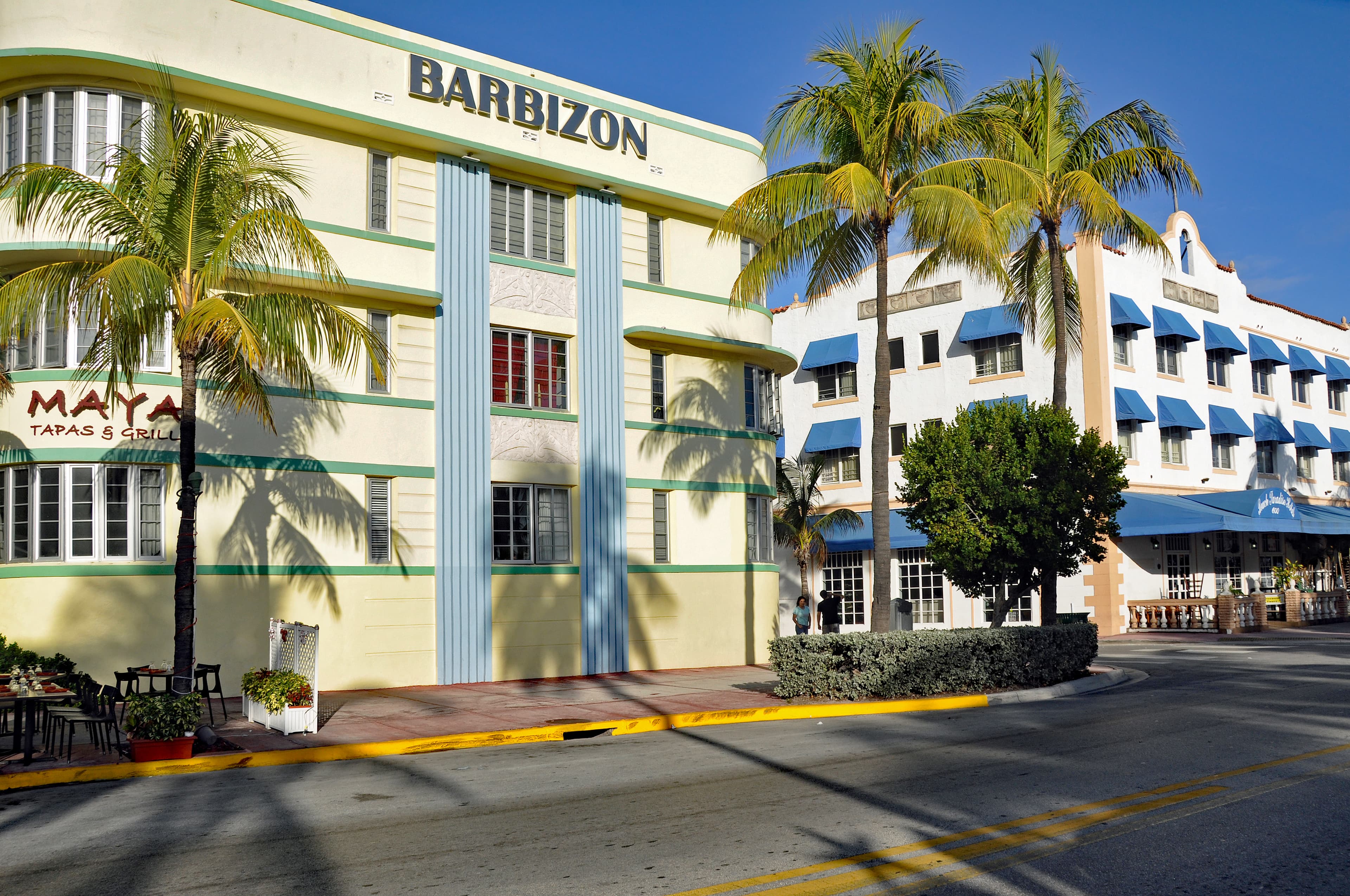 Pastel Art Deco hotels along Ocean Drive in Miami Beach facing Lummus Park and the beach