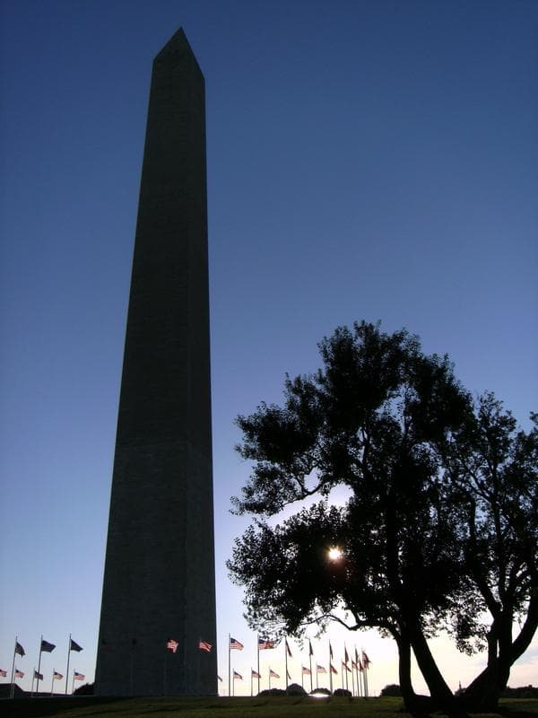 The Washington Monument silhouetted against the dawn sky at sunrise