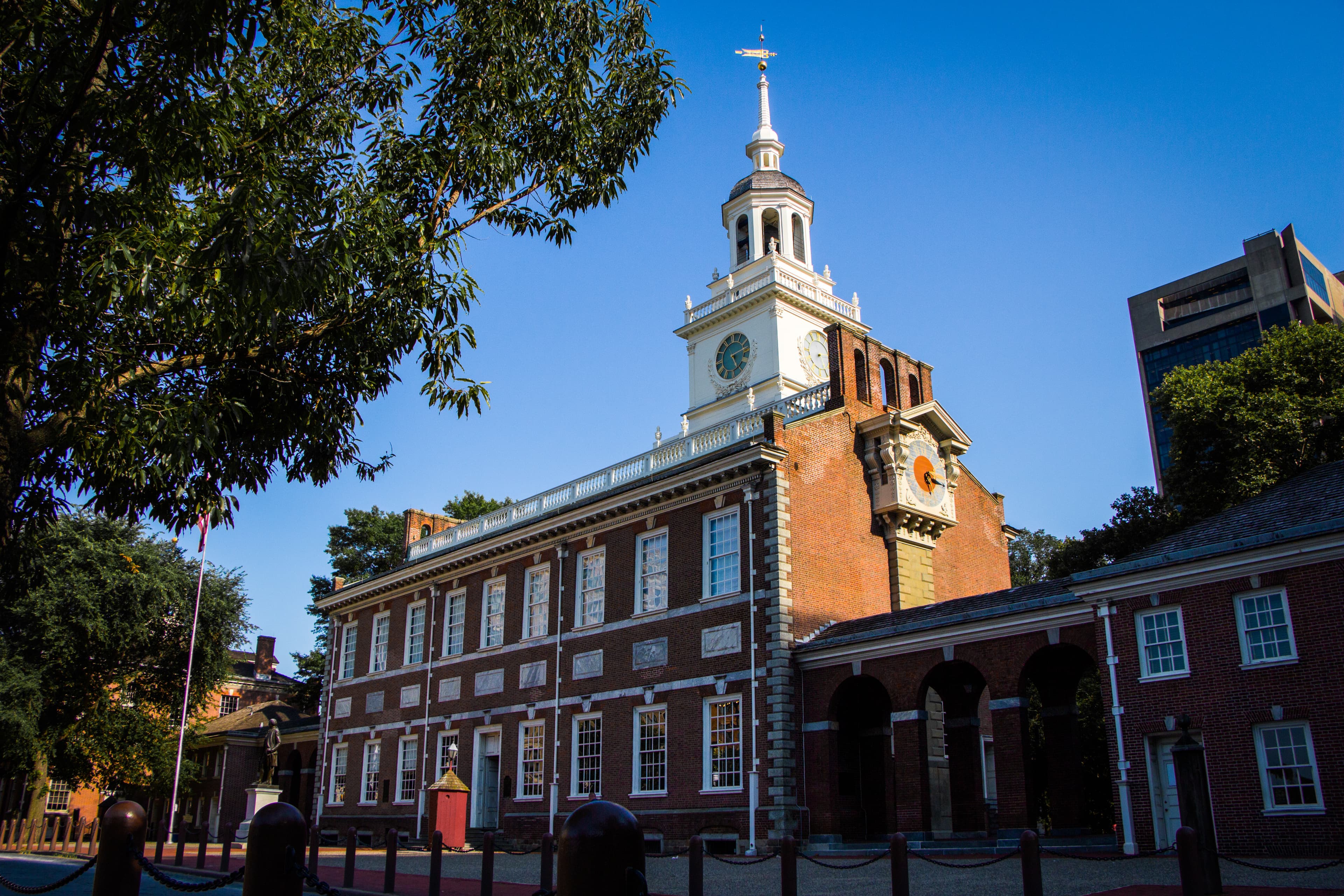 The Chestnut Street front of Independence Hall — the red-brick Georgian facade and steeple as visitors approach from Independence Mall