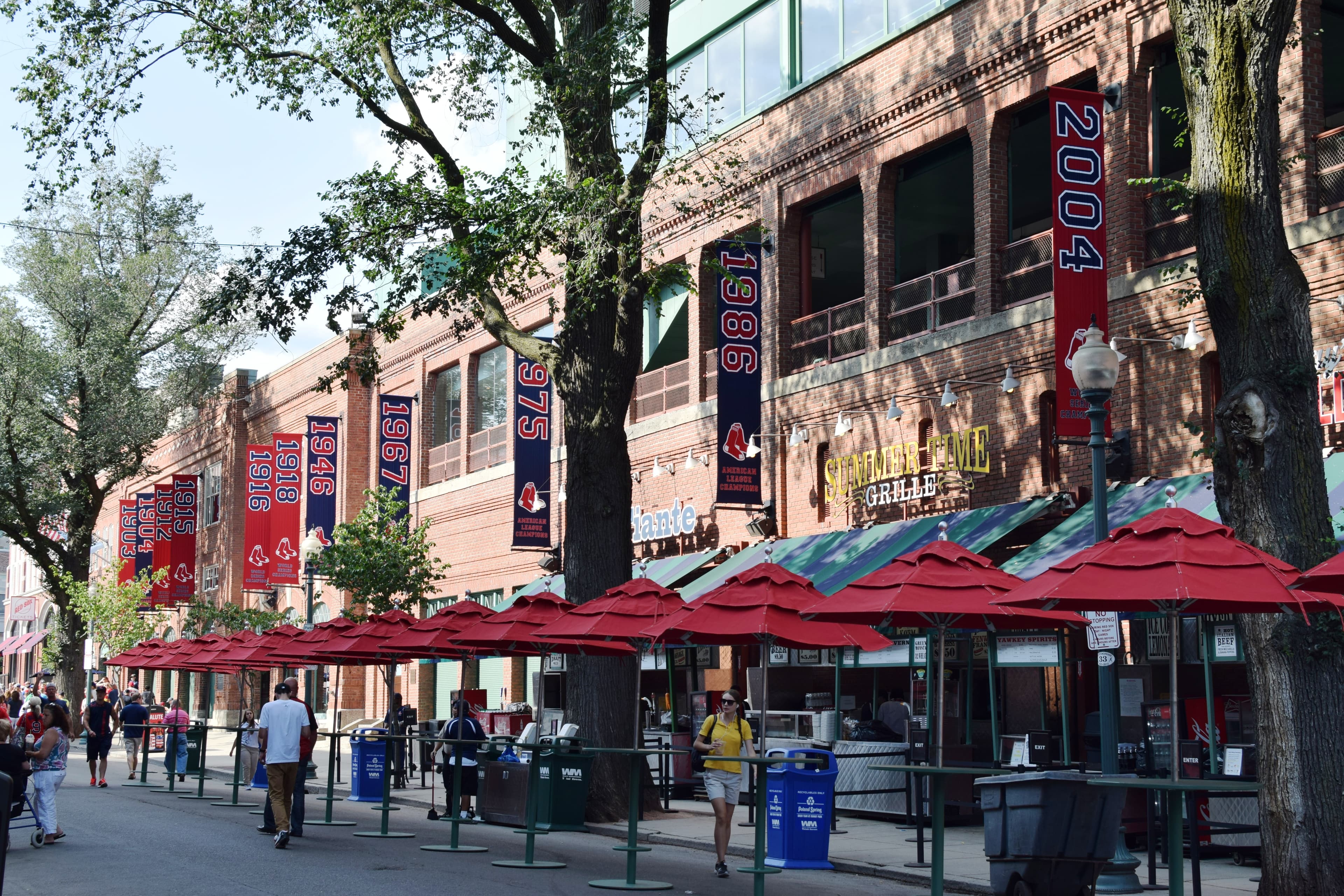 Hero photo: Vegasjon, CC BY-SA, via Wikimedia Commons. Fenway Park before a game in July 2014, the field prepared and the stands filling, with the Green Monster visible in left field.