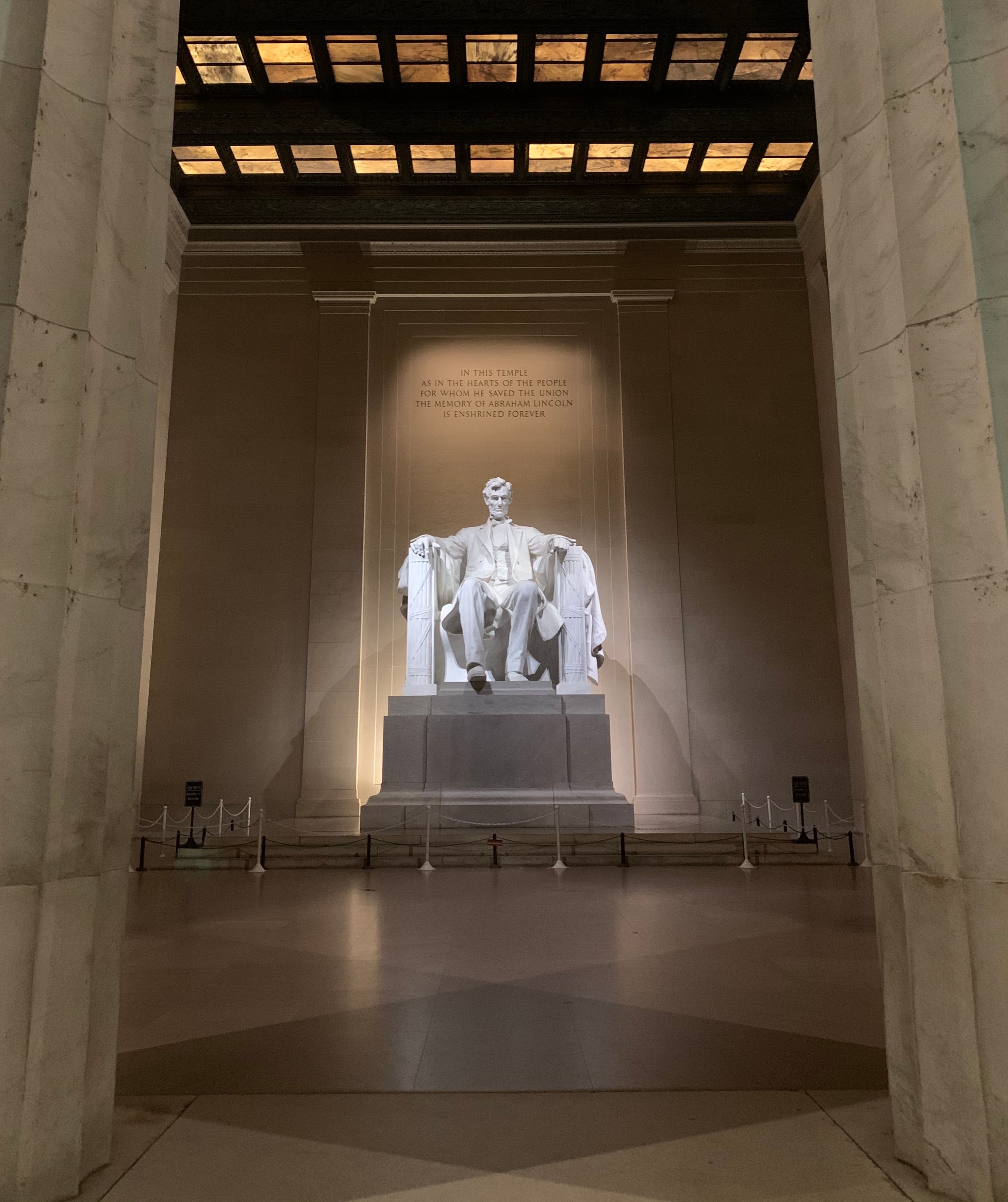 Inside the Lincoln Memorial's central chamber with the statue between the speech inscriptions