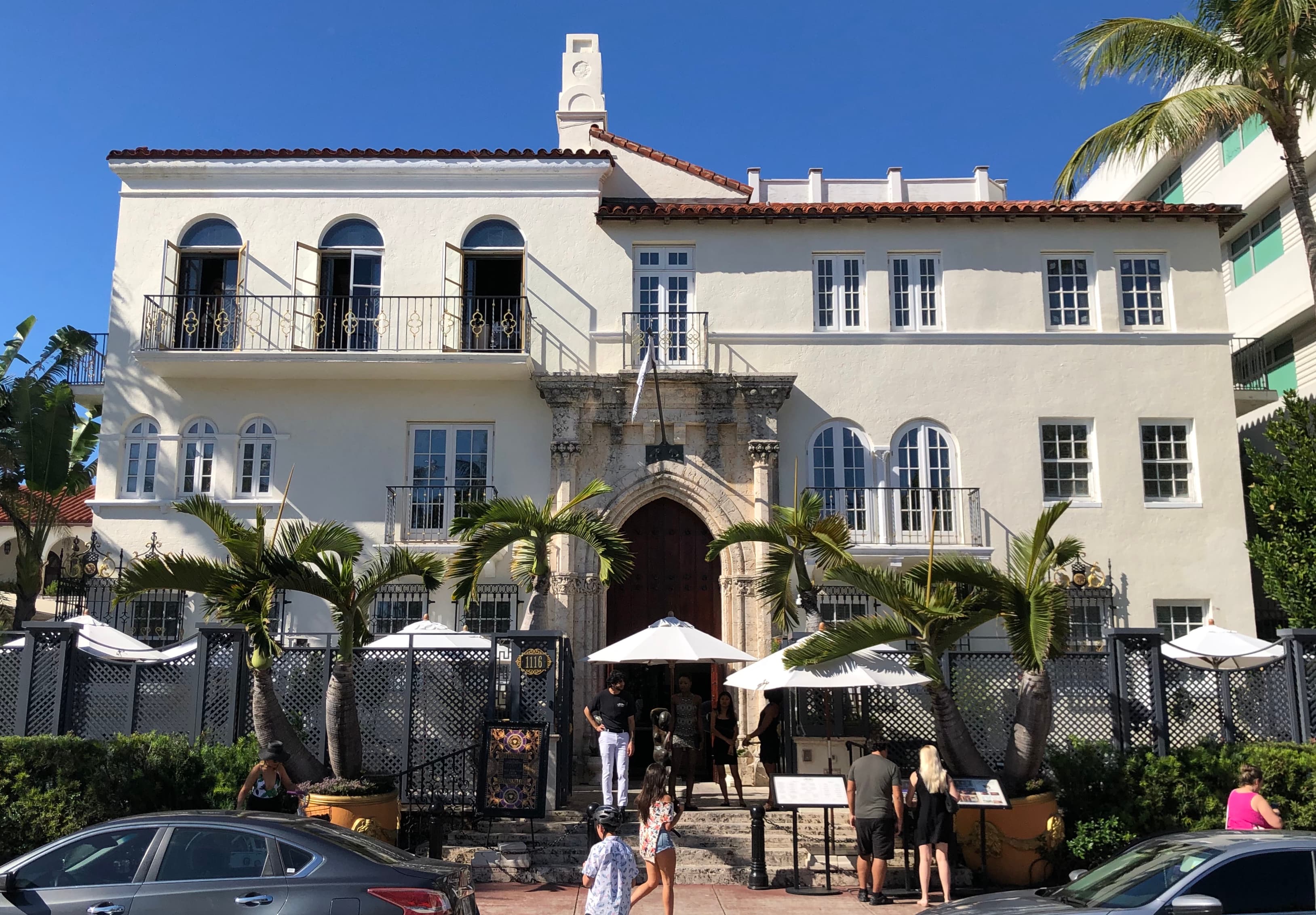 Casa Casuarina at 1116 Ocean Drive, the 1930 Mediterranean Revival mansion, seen from the public sidewalk