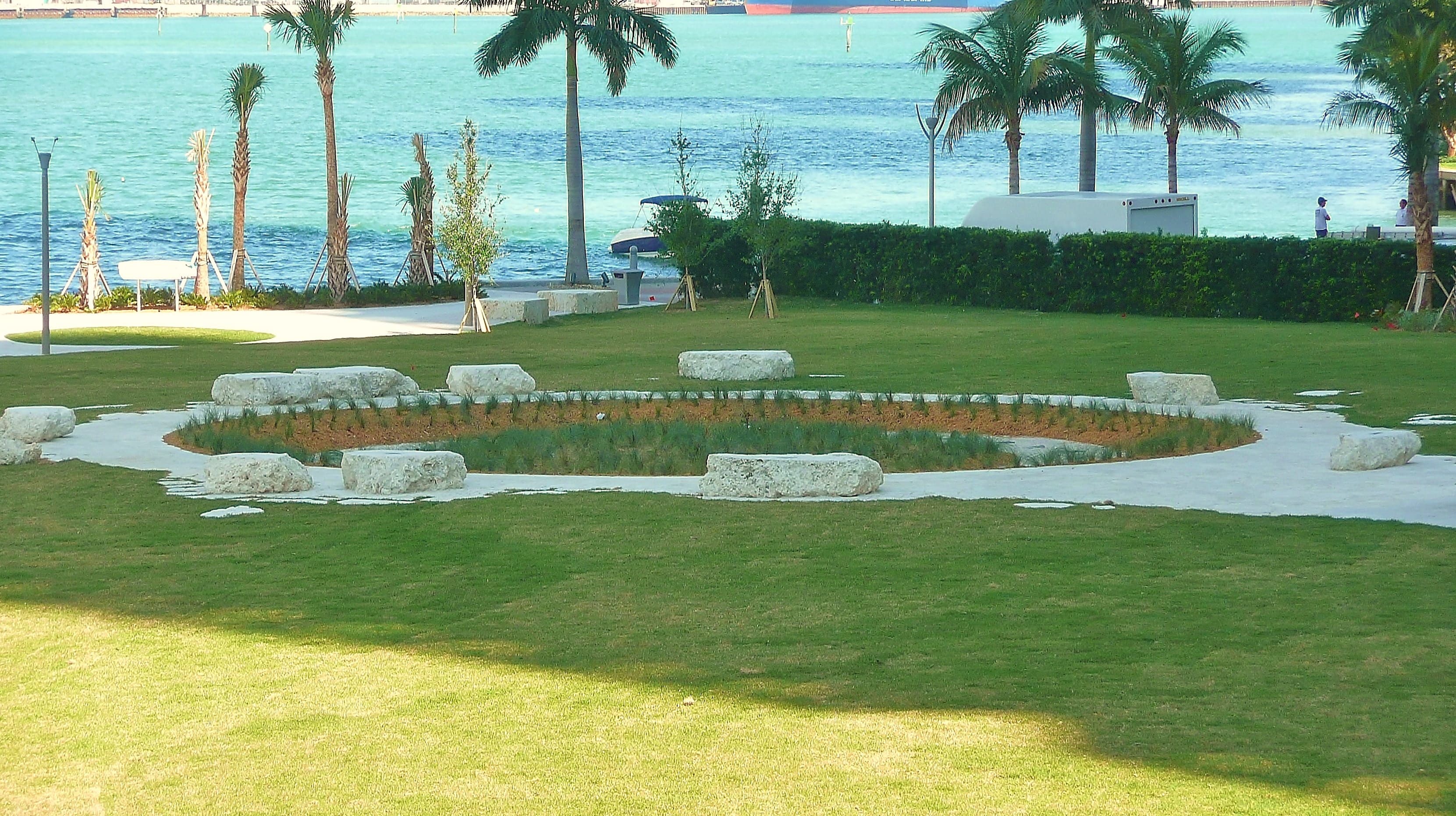 Miami Circle Park at Brickell Point — the 38-foot circle's outline on the riverfront lawn, with the reburied Tequesta feature protected beneath it.