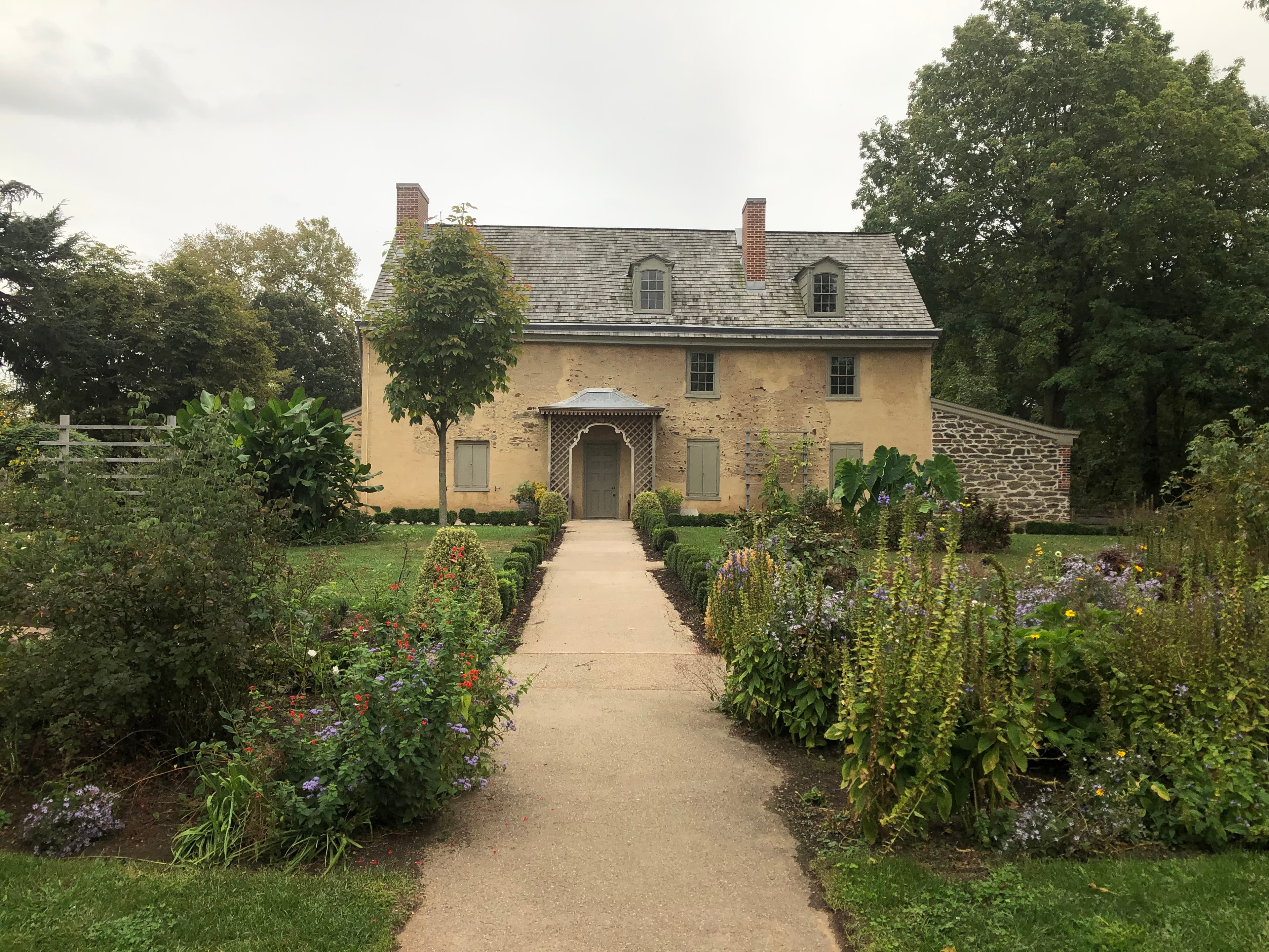 The front of John Bartram's historic stone house in Philadelphia — the house he built in 1728–1731 and dressed in its carved Palladian facade.