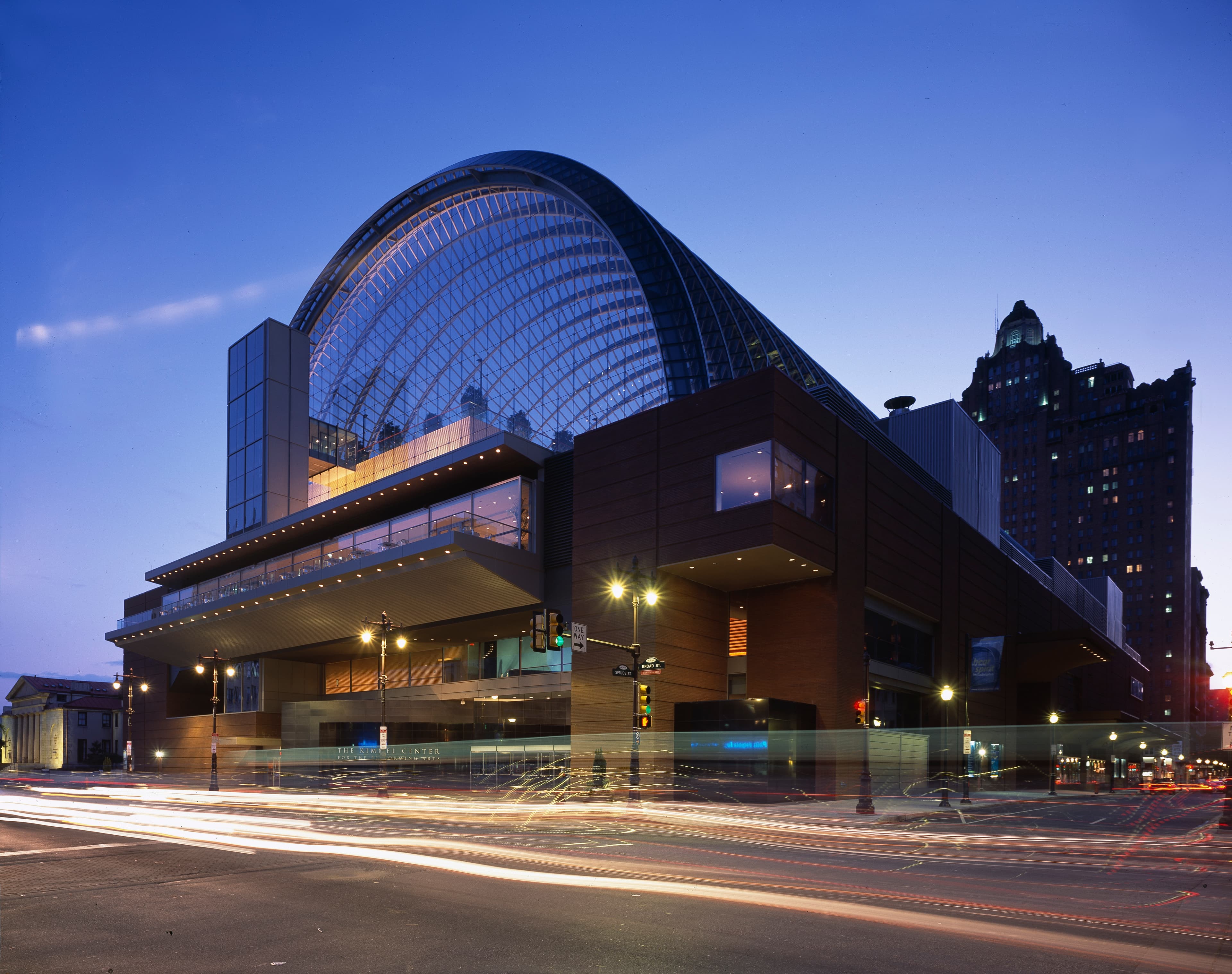 Exterior view of the Kimmel Center concert hall in Philadelphia — the building's Broad Street frontage, not an interior hall view.