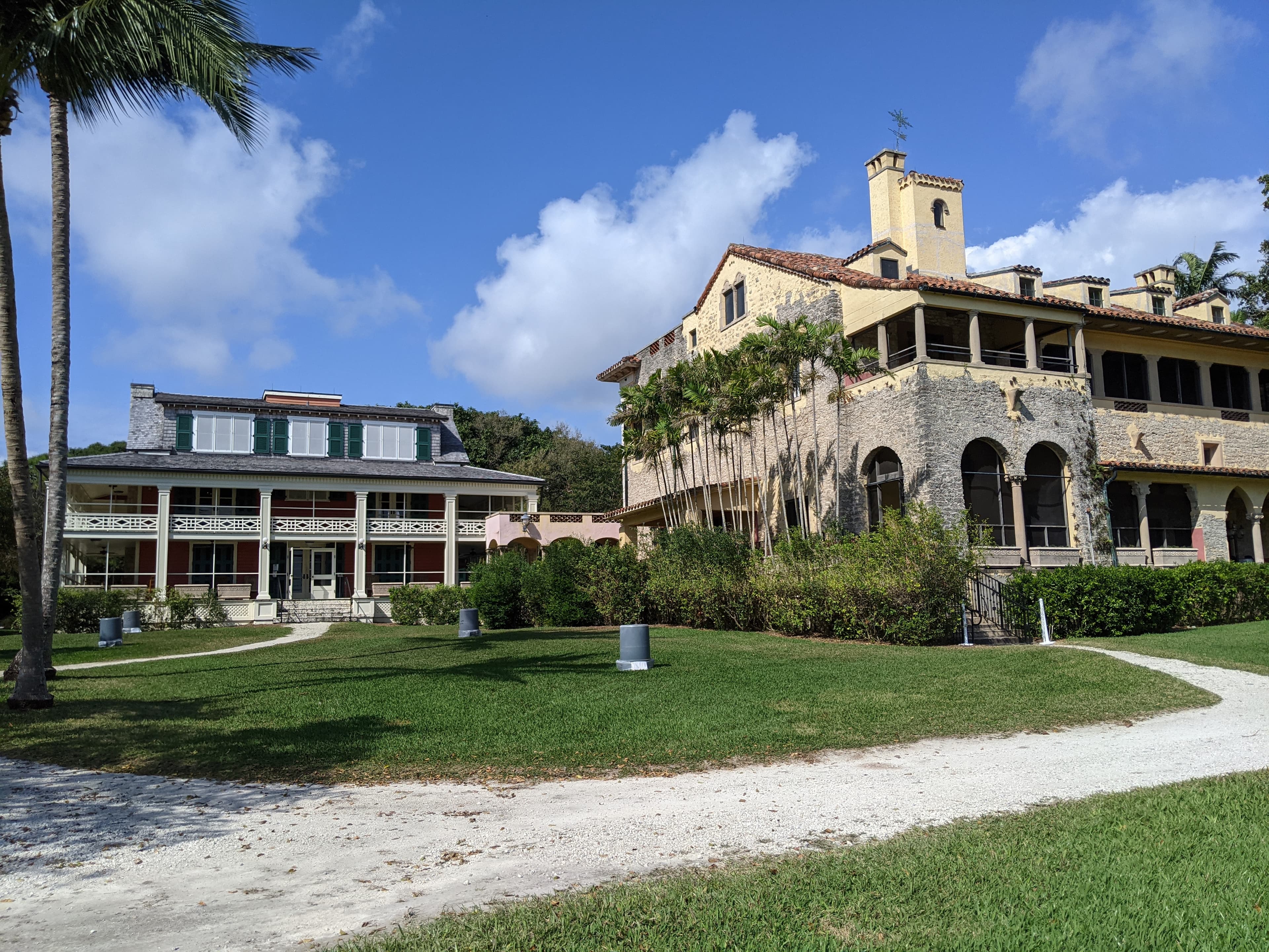 The Deering Estate's two houses above Biscayne Bay — the 1900 Richmond Cottage and the fireproof 1922 Stone House, inside 444 acres of preserved hammock and pine rockland.
