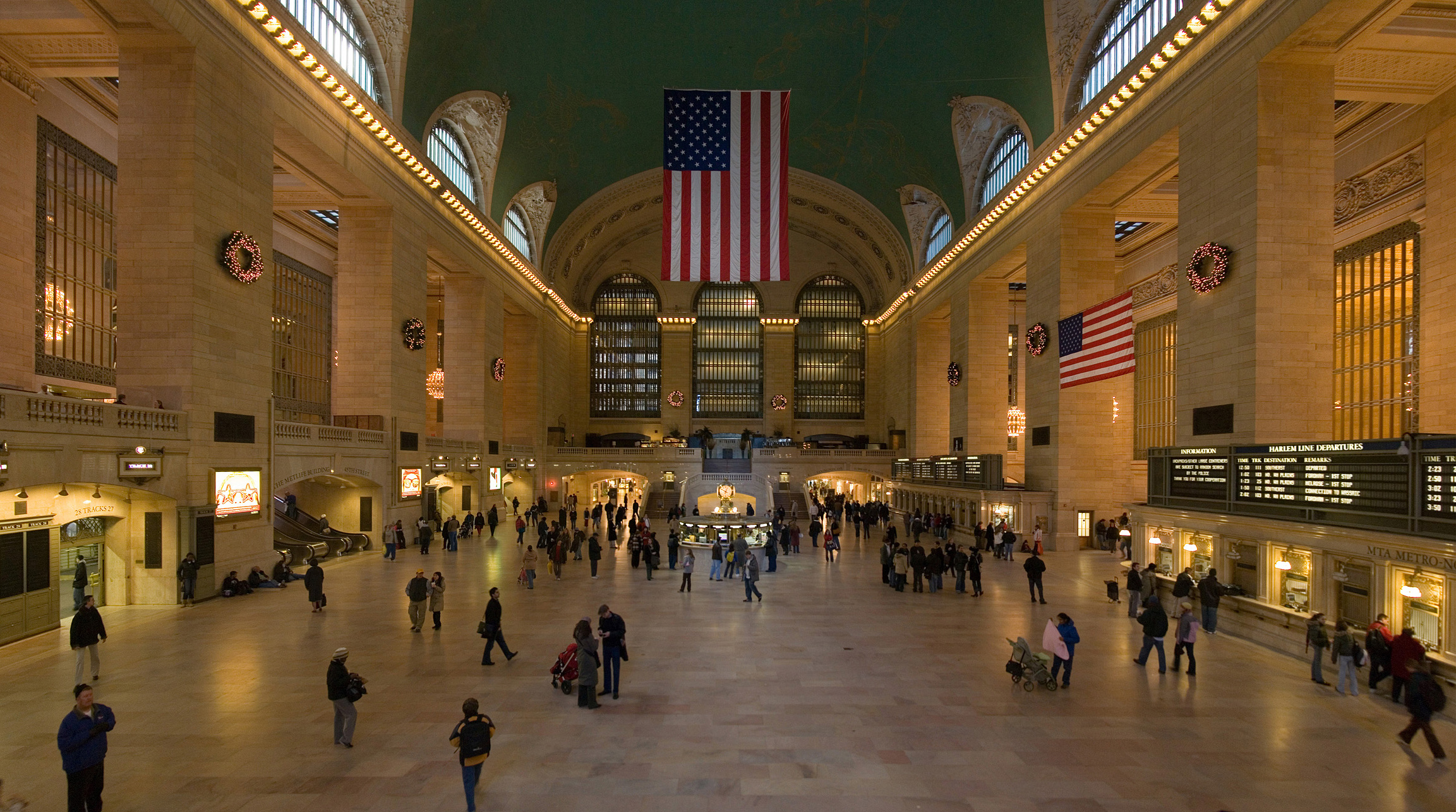 The Main Concourse of Grand Central Terminal, photographed in January 2006 — the classic wide view of the concourse, its arched windows, and the information booth clock.
