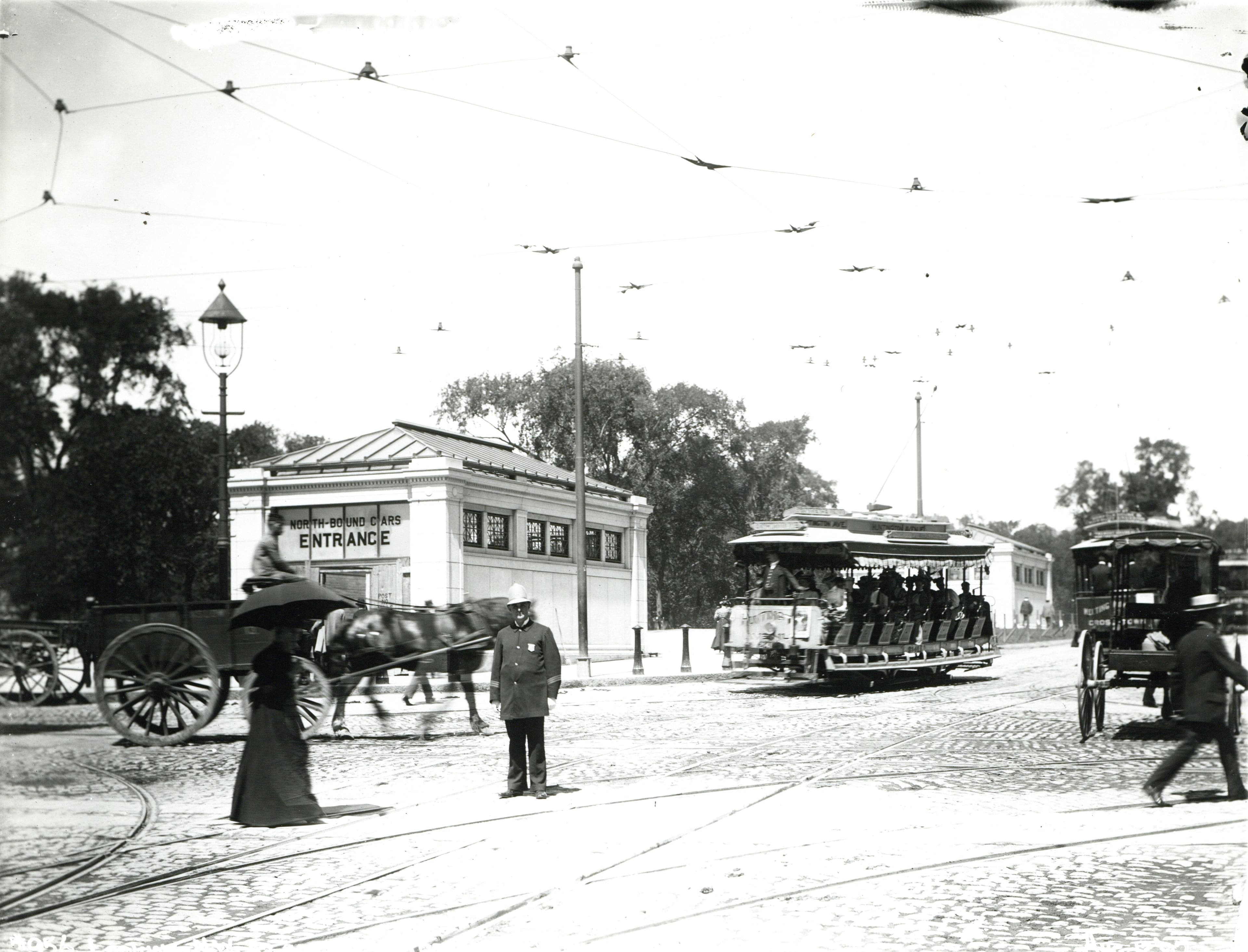 Looking north on Tremont Street from Boylston, August 1897 — open streetcars and the station headhouse days before the subway opened.