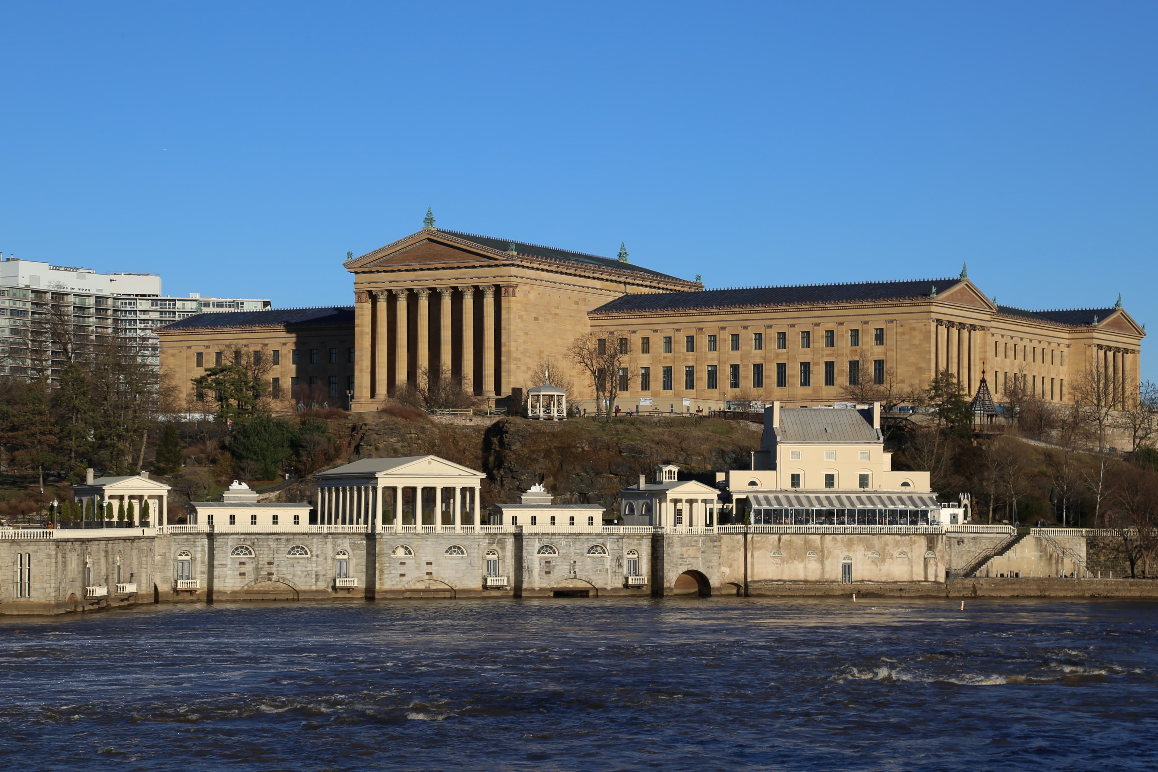 Photo: Zhicheng Zhao, CC BY-SA 4.0, via Wikimedia Commons. The museum seen with the Fairmount Water Works on the Schuylkill River below.